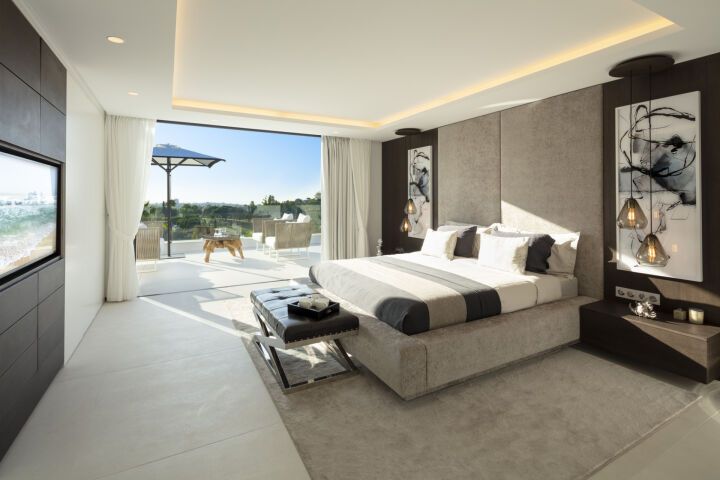 Bedroom in a villa in Nueva Andalucia with sliding doors to a terrace and garden views